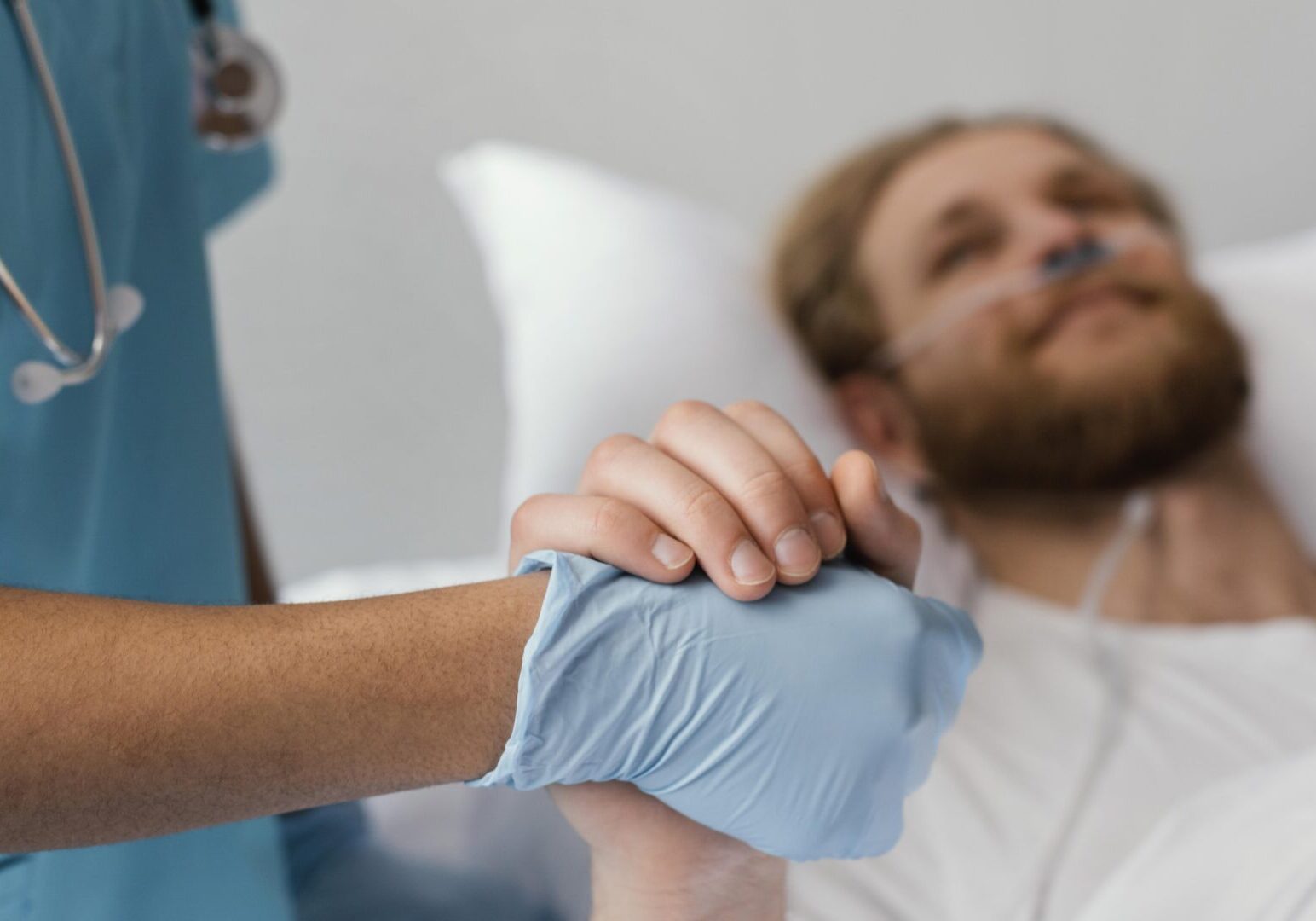 close-up-patient-health-worker-holding-hands